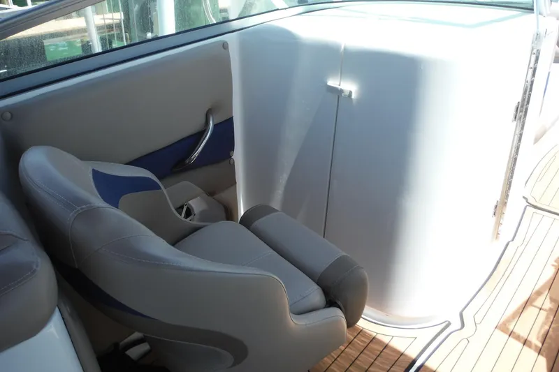 Slide: The Image of 2018 Hurricane SunDeck 2690 OB boat interior with seating and storage compartment. - 8