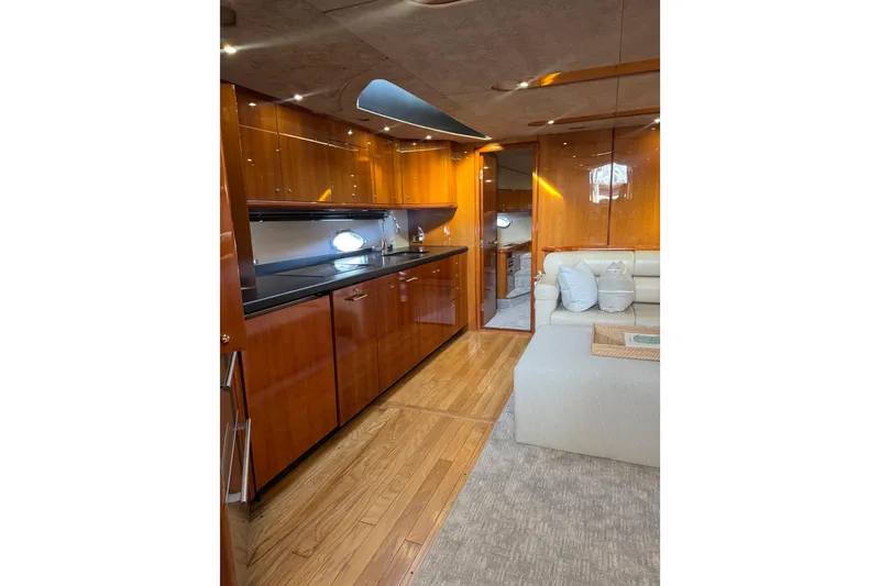 Slide: The Image of Luxurious interior of 2004 Sunseeker Predator 68 yacht with sleek wood finishes. - 11