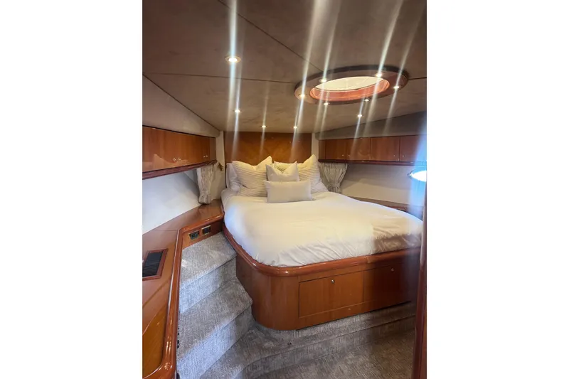 Slide: The Image of Luxurious bedroom interior of 2004 Sunseeker Predator 68 yacht with elegant wood finish. - 12