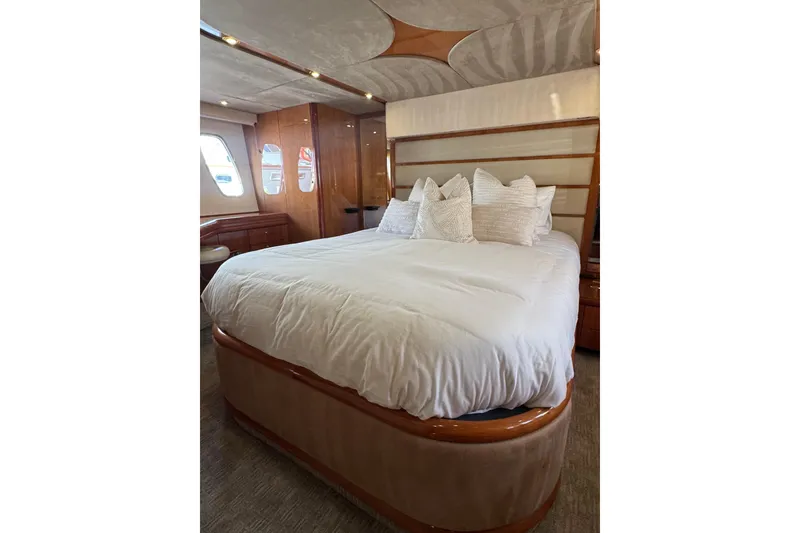 Slide: The Image of Luxurious bedroom interior of 2004 Sunseeker Predator 68 yacht with elegant bedding. - 13