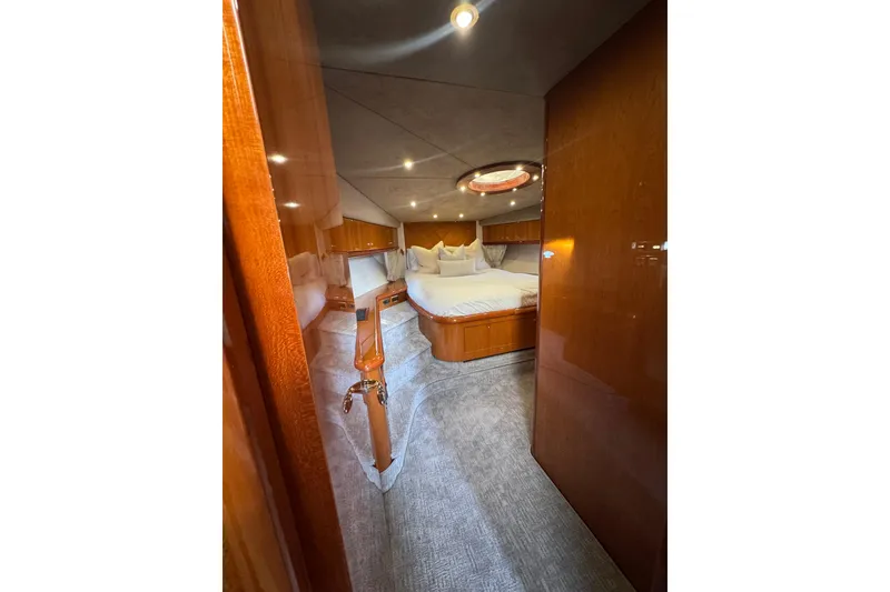 Slide: The Image of Luxurious cabin interior of 2004 Sunseeker Predator 68 yacht with elegant wood finishes. - 14