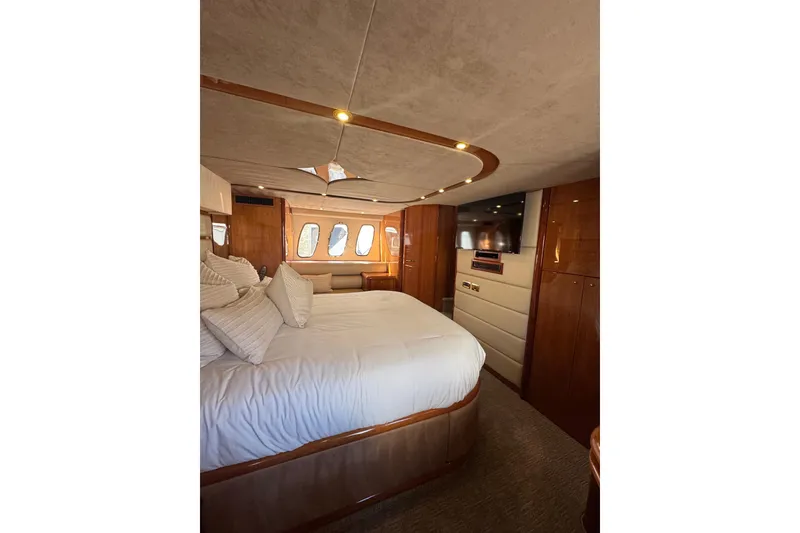 Slide: The Image of Luxurious bedroom interior of 2004 Sunseeker Predator 68 yacht with elegant wood finishes. - 17