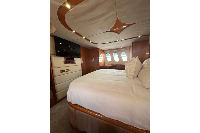 Slide: The Image of Luxurious bedroom interior of 2004 Sunseeker Predator 68 yacht with elegant design and cozy bedding. - 20
