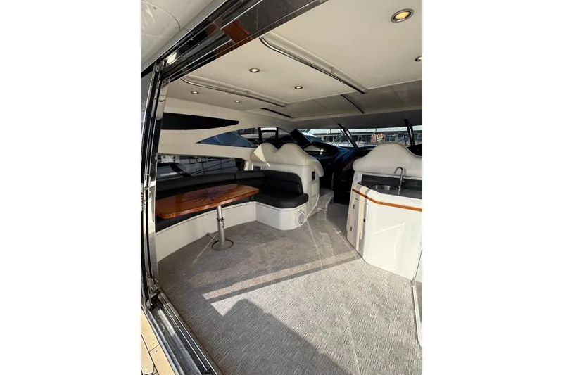 Slide: The Image of Luxurious interior of 2004 Sunseeker Predator 68 yacht with seating and table. - 25