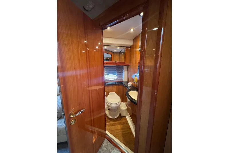 Slide: The Image of Luxurious bathroom interior of 2004 Sunseeker Predator 68 yacht with wooden finishes. - 27