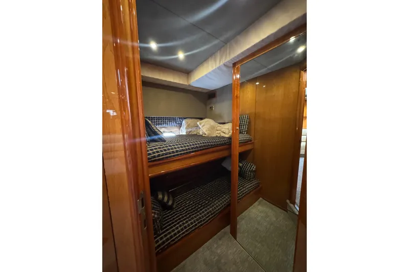 Slide: The Image of Interior cabin of 2004 Sunseeker Predator 68 yacht with bunk beds and wooden finish. - 3