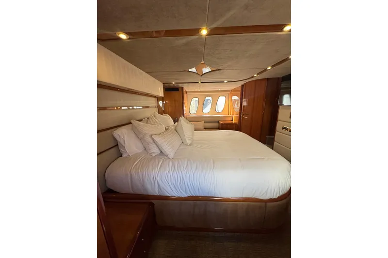 Slide: The Image of Luxurious bedroom interior of 2004 Sunseeker Predator 68 yacht with elegant bedding. - 5