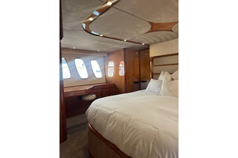 Slide: The Image of Luxurious bedroom interior of 2004 Sunseeker Predator 68 yacht with elegant wood finishes. - 6