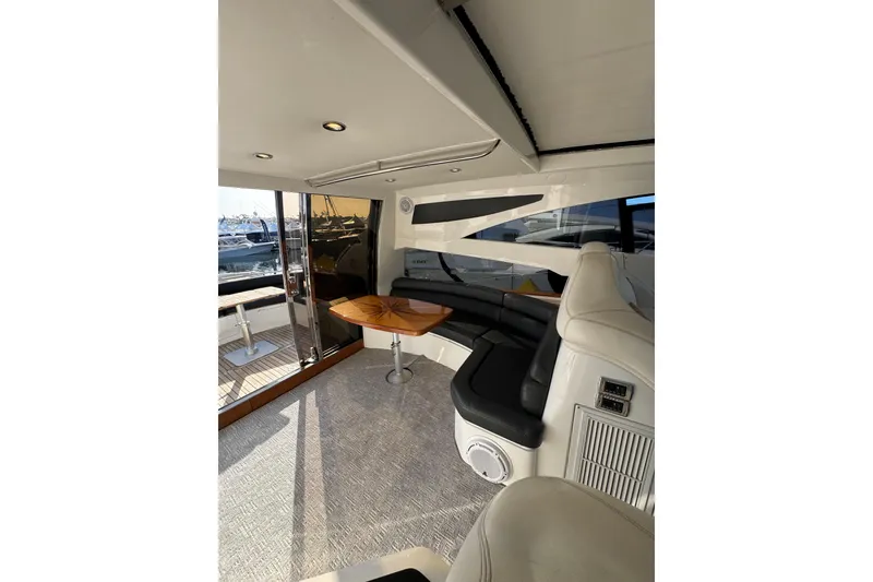 Slide: The Image of Luxurious interior of 2004 Sunseeker Predator 68 yacht with elegant seating and table. - 7