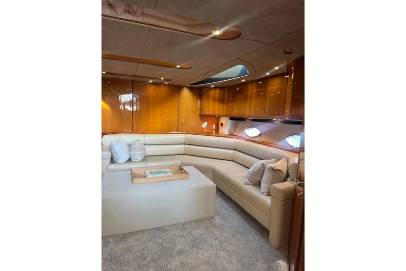 Slide: The Image of Luxurious interior of 2004 Sunseeker Predator 68 yacht with plush seating and elegant wood paneling. - 8