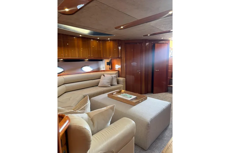 Slide: The Image of Luxurious interior of 2004 Sunseeker Predator 68 yacht with elegant seating and wood finishes. - 9