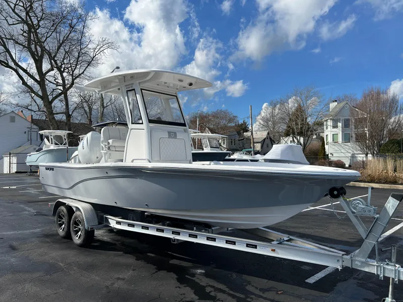 Slide: The Image of 2024 Sea Fox 231 Bay Fox boat on a trailer in a parking lot. - 12