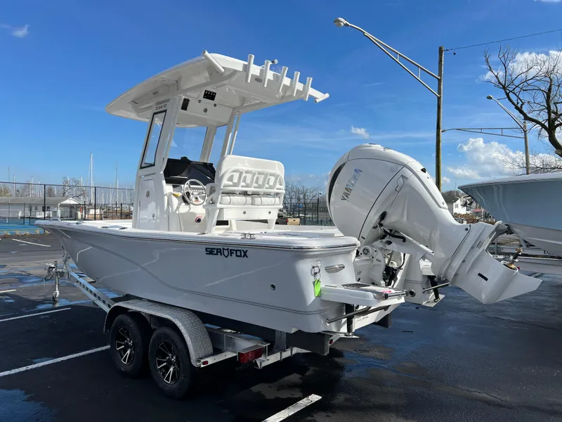 Slide: The Image of 2024 Sea Fox 231 Bay Fox boat on a trailer with Yamaha outboard motor. - 15