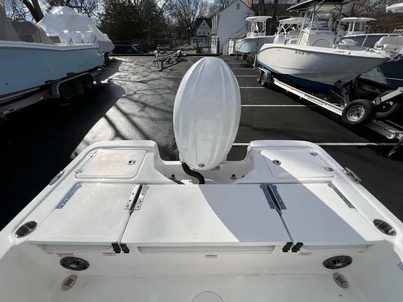 Slide: The Image of 2024 Sea Fox 231 Bay Fox boat, rear view in a marina. - 19