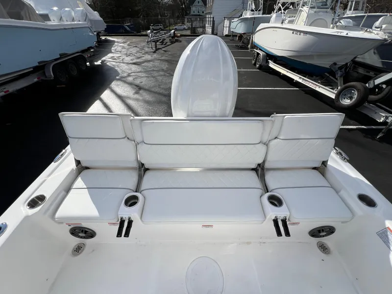 Slide: The Image of 2024 Sea Fox 231 Bay Fox boat interior with white cushioned seating. - 20