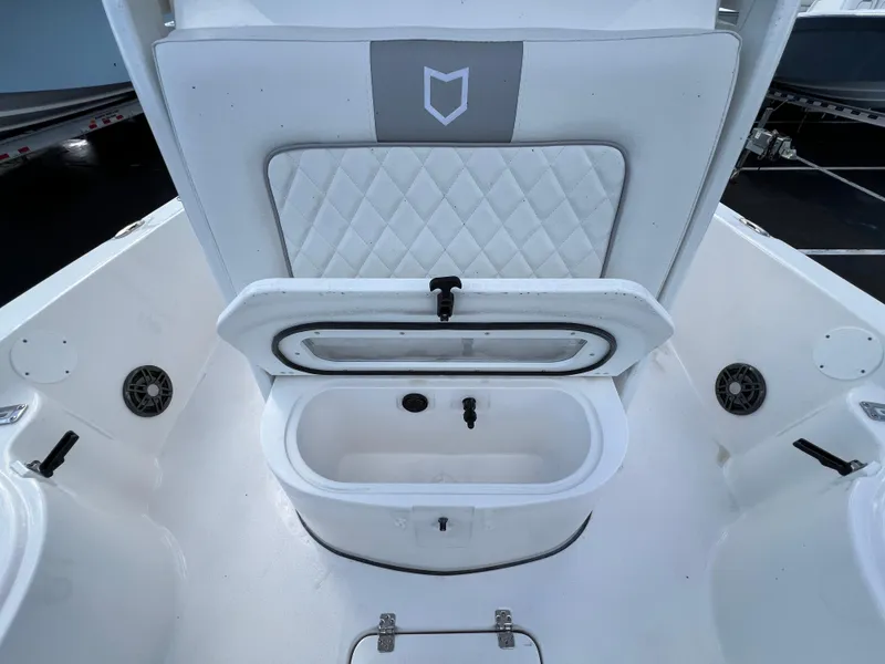 Slide: The Image of 2024 Sea Fox 231 Bay Fox boat interior with open storage compartment. - 24