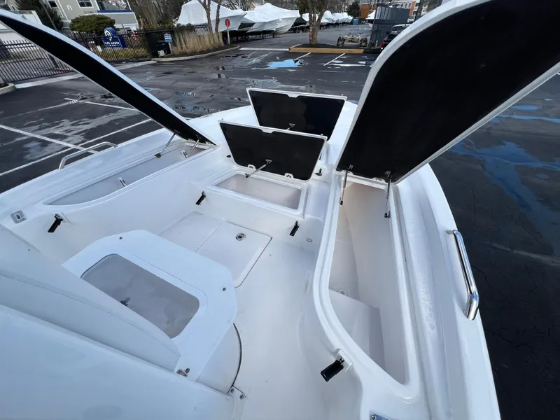 Slide: The Image of 2024 Sea Fox 231 Bay Fox boat with open storage compartments. - 27