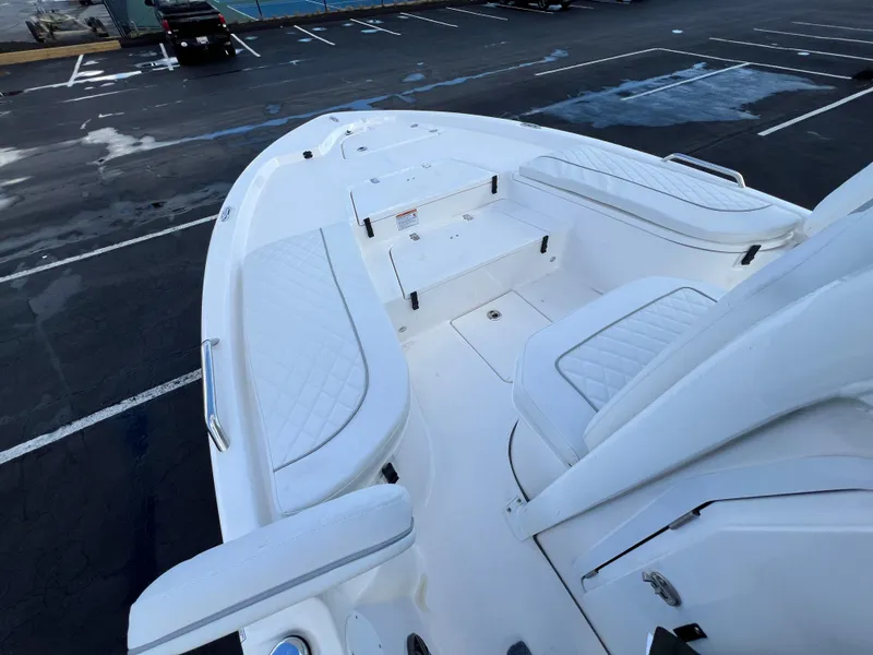 Slide: The Image of 2024 Sea Fox 231 Bay Fox boat interior with white cushioned seating. - 29