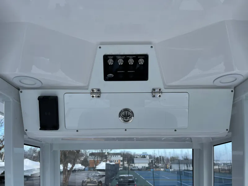 Slide: The Image of 2024 Sea Fox 231 Bay Fox boat console with control panel and storage compartment. - 33