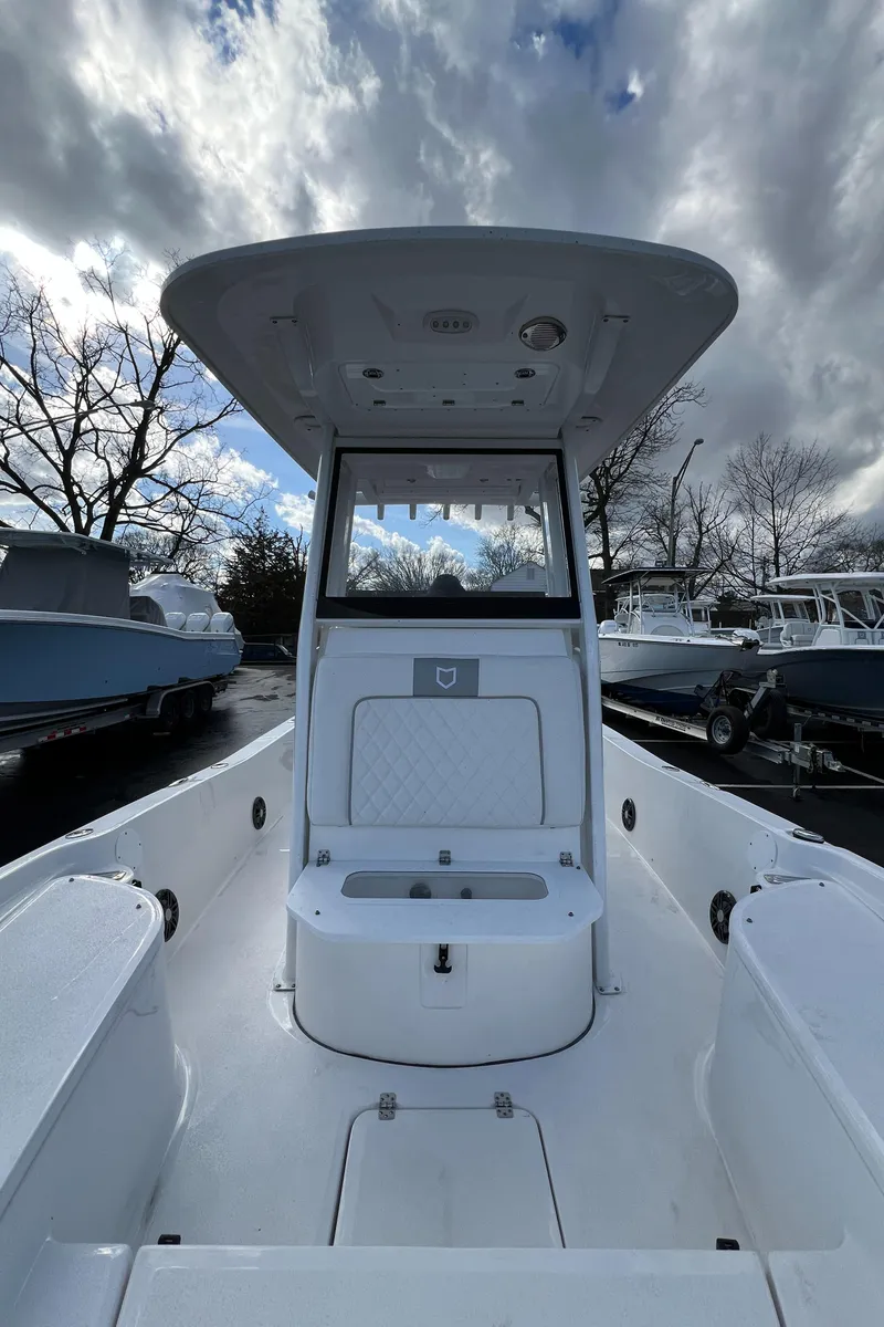 Slide: The Image of 2024 Sea Fox 231 Bay Fox boat interior with T-top and seating. - 35