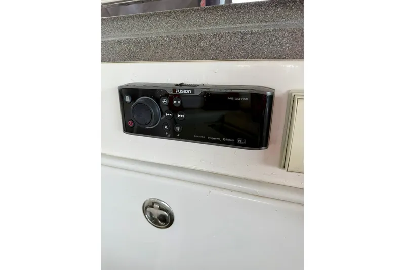 Slide: The Image of Fusion MS-UD755 stereo system on 2006 Regal Commodore 4060 yacht dashboard. - 13