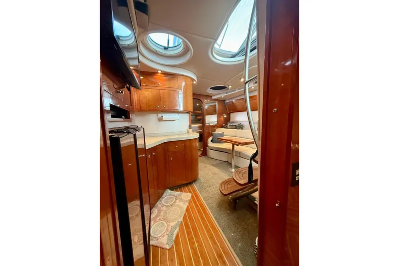 Slide: The Image of Luxurious interior of 2006 Regal Commodore 4060 yacht with wood finishes and skylights. - 14