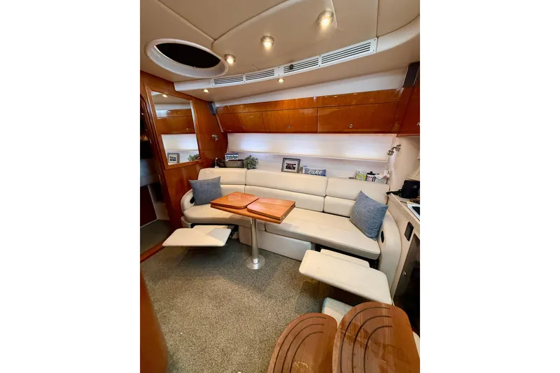 Slide: The Image of Luxurious interior of 2006 Regal Commodore 4060 yacht with plush seating and elegant wood finishes. - 15