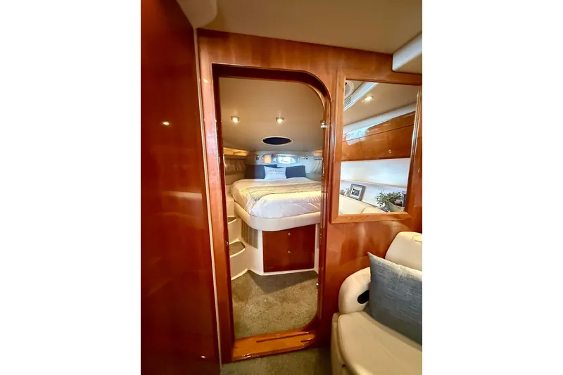 Slide: The Image of Luxurious cabin interior of 2006 Regal Commodore 4060 yacht with cozy bed and wooden finish. - 20