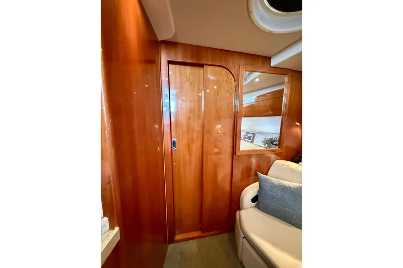 Slide: The Image of Interior of 2006 Regal Commodore 4060 yacht with wooden paneling and seating. - 21