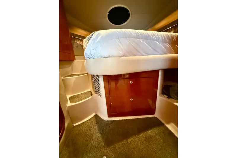 Slide: The Image of Interior of 2006 Regal Commodore 4060 yacht with bed and storage. - 23