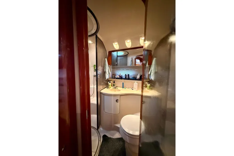 Slide: The Image of Luxurious bathroom interior of 2006 Regal Commodore 4060 yacht, featuring modern amenities. - 25