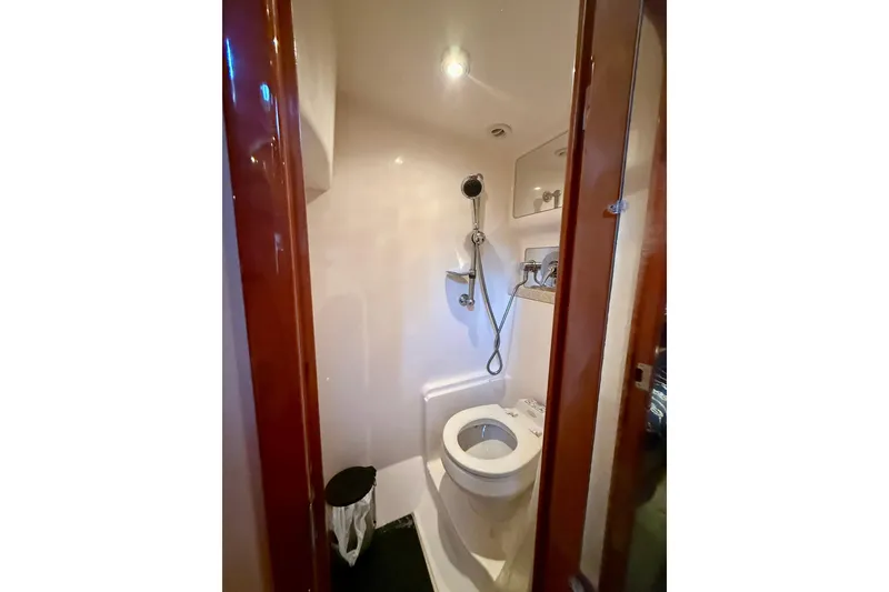 Slide: The Image of Compact bathroom in 2006 Regal Commodore 4060 yacht with shower and toilet. - 31