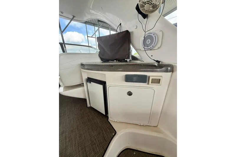 Slide: The Image of 2006 Regal Commodore 4060 yacht interior with kitchenette and storage area. - 9