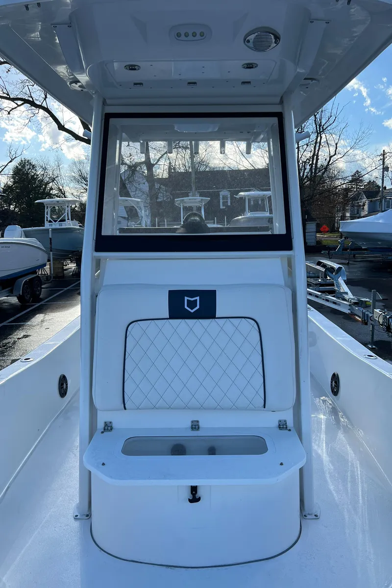 Slide: The Image of 2024 Sea Fox 251 Bay Fox boat interior with seating and console. - 8