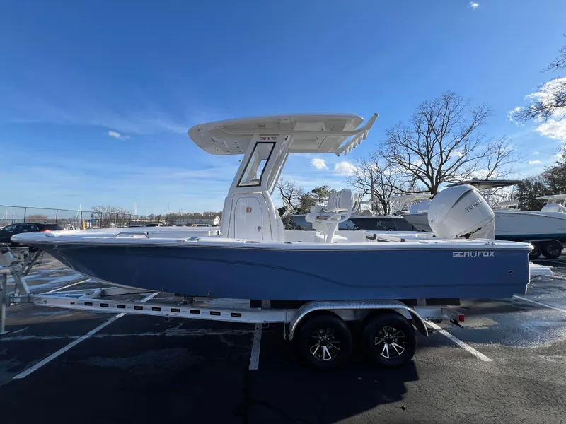 Slide: The Image of 2024 Sea Fox 251 Bay Fox boat on trailer, parked outdoors. - 4