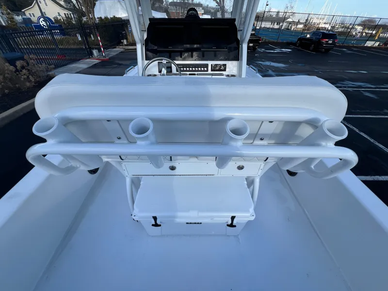 Slide: The Image of 2024 Sea Fox 251 Bay Fox boat interior with rod holders and console. - 12