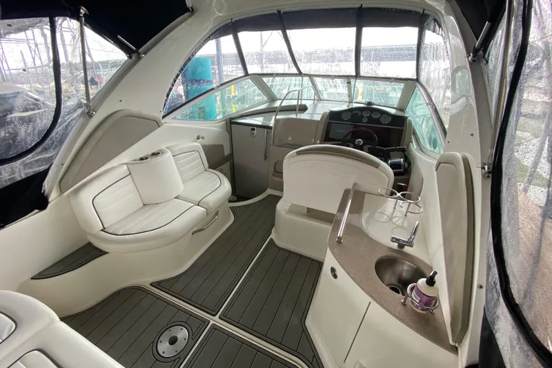 Slide: The Image of Interior of 2006 Sea Ray 290 Sundancer boat with seating and helm. - 24