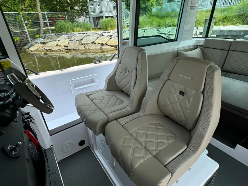 Slide: The Image of 2024 Axopar 37 Cross Cabin XC interior with luxurious seating and modern design. - 14