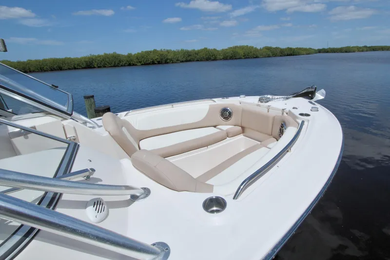 Slide: The Image of 2013 Grady-White Freedom 275 boat with spacious seating on calm water. - 2