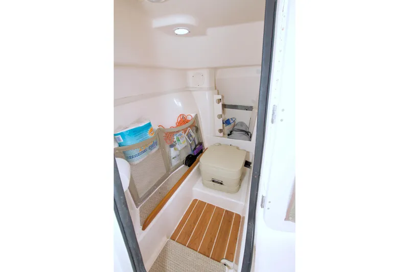 Slide: The Image of Interior cabin of 2013 Grady-White Freedom 275 boat with storage and amenities. - 21