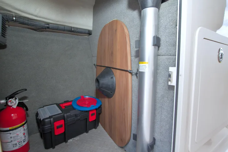 Slide: The Image of Storage compartment in a 2013 Grady-White Freedom 275 boat with safety equipment. - 26