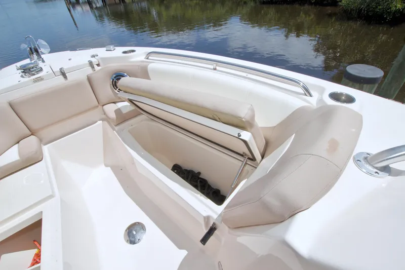 Slide: The Image of 2013 Grady-White Freedom 275 boat interior with open storage compartment and seating. - 30