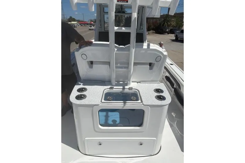 Slide: The Image of 2026 Tidewater 3100 Carolina Bay boat interior with fishing station and rod holders. - 4