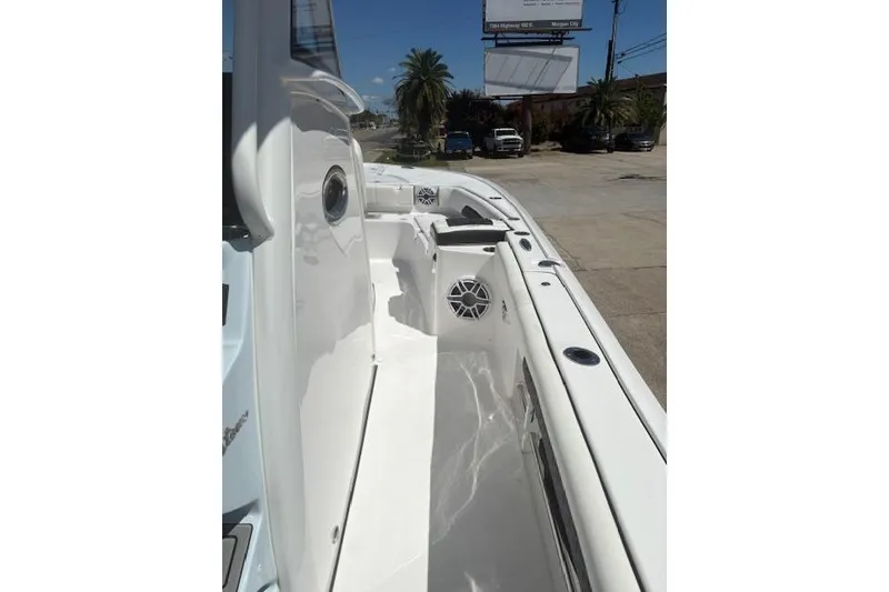 Slide: The Image of 2026 Tidewater 3100 Carolina Bay boat interior with sleek white design and modern features. - 5