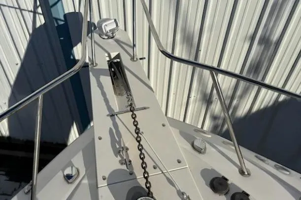 Slide: The Image of Bow of 2003 Wellcraft 330 Coastal boat with anchor chain and railing. - 2