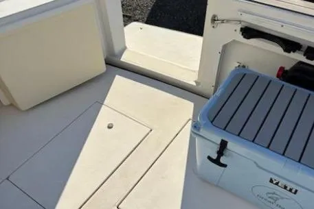 Slide: The Image of 2003 Wellcraft 330 Coastal boat deck with storage compartments and cooler. - 5