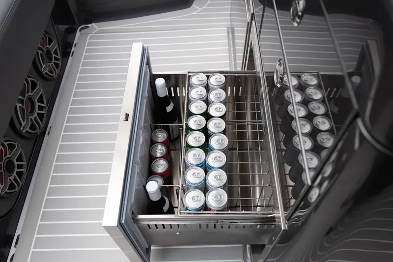 Slide: The Image of Built-in cooler with drinks on the 2025 Cigarette 42' Auroris boat. - 8