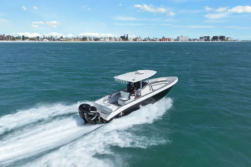Slide: The Image of 2012 Statement 350 Open boat cruising on open sea under sunny skies. - 0
