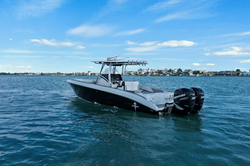 Slide: The Image of 2012 Statement 350 Open boat on calm water with blue sky. - 10