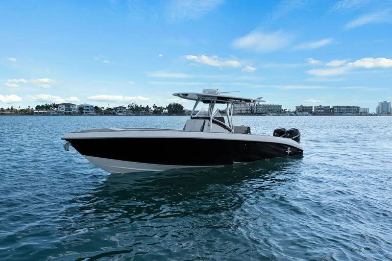 Slide: The Image of 2012 Statement 350 Open boat on calm water. - 12